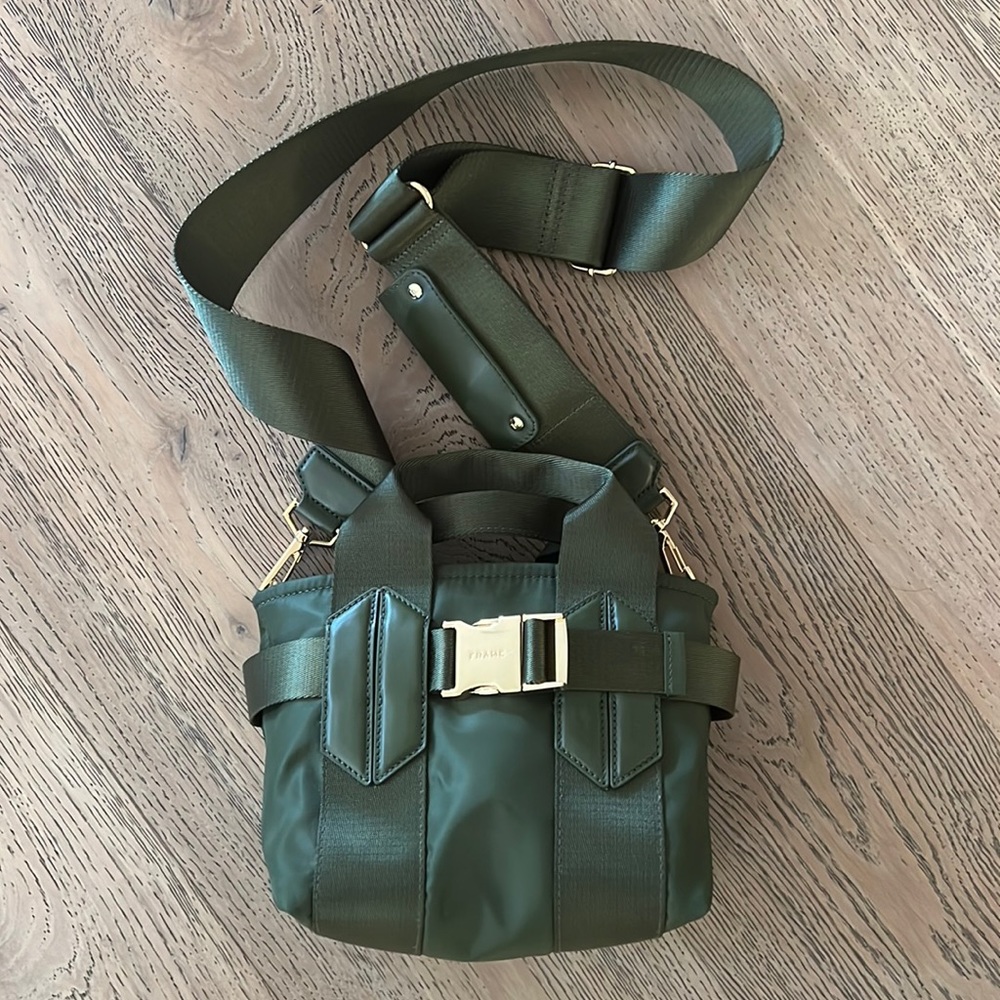 Small Frame purse, green nylon with leather trim and gold hardware. Never used.